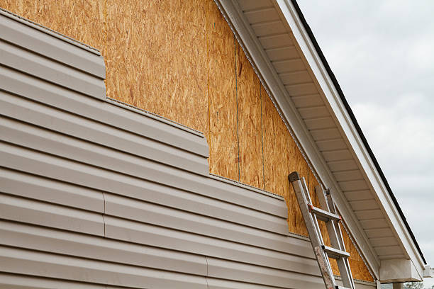 Professional Siding Installation technician working in Highland, MD